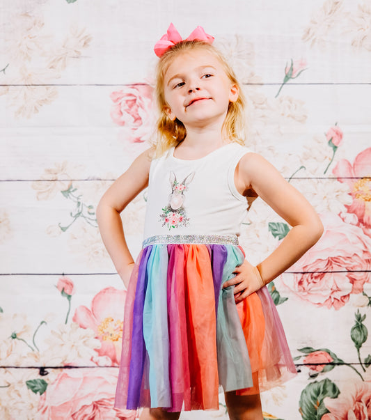 Little Girl Rainbow colored tutu dress featuring a bunny blowing a bubble on the front and a sparkly grey belt.